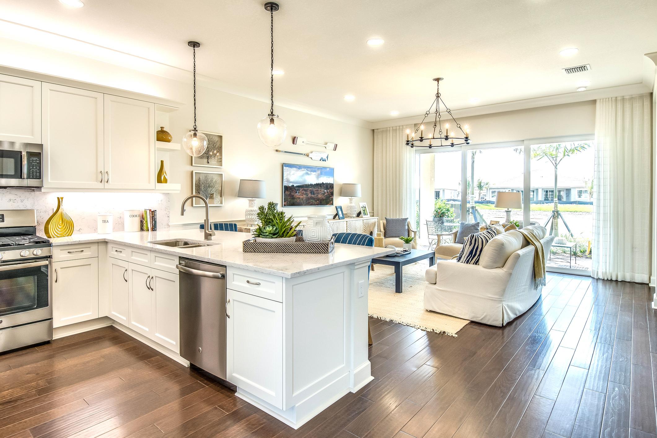 Amenities in new kitchen include pull down faucet and pendant lighting